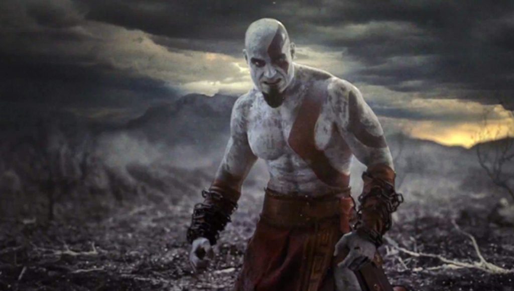 An image of Kratos covered in the ashes of his family, just the start of the God of War timeline.