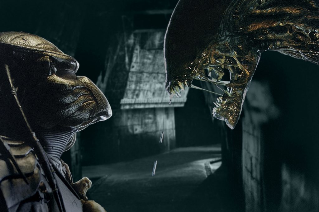 Alien and Predator facing off in AVP: Alien vs Predator.