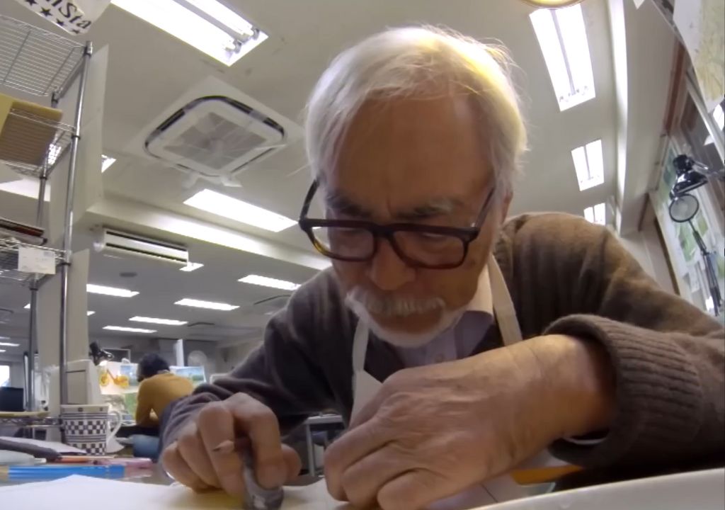 Hayao Miyazaki is seen drawing something.