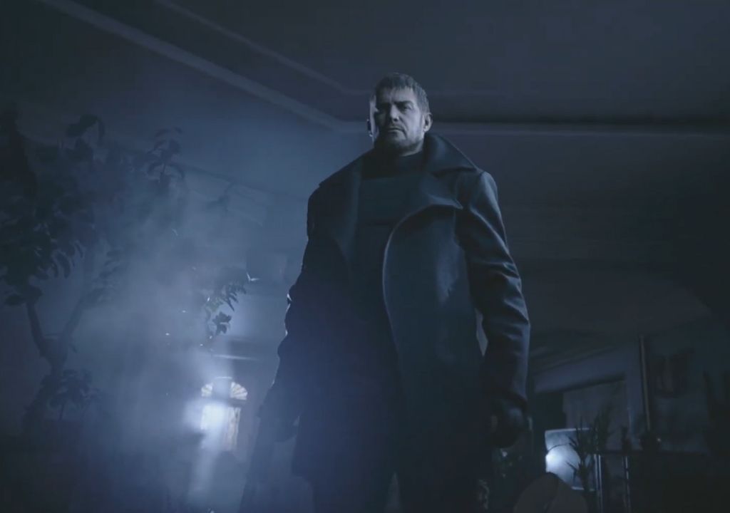 Chris Redfield stands holding a gun