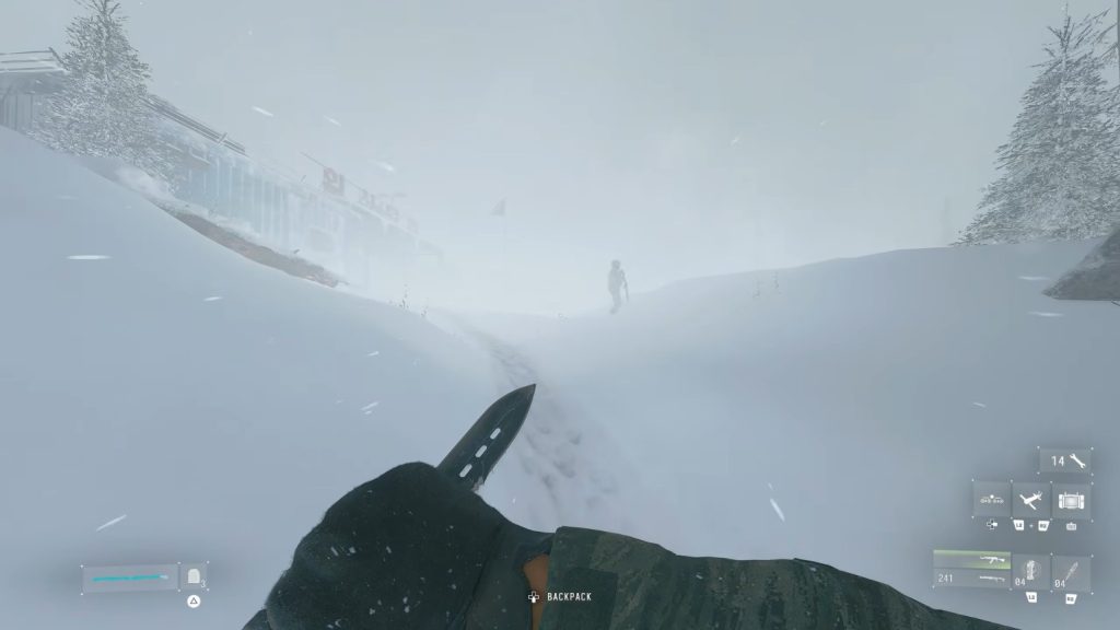 Player approaching a patrolling soldier in a snowstorm to kill.