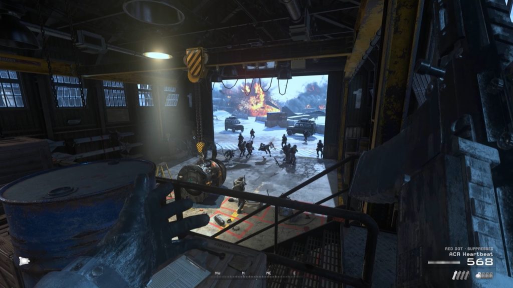 Soap is seen inside the hanger with his hands in the air as several enemy soldiers point their rifles on him.