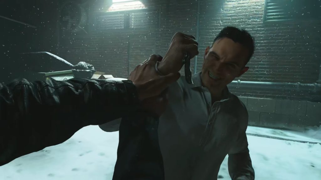 Price holds Makarov's hand with force to stop him from stabbing with a knife as they fight in a snow-covered alley