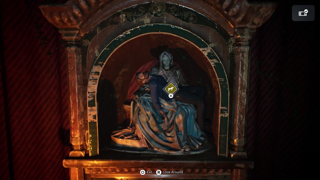 Remothered: Red Nun's Legacy the father puppet on a statue.