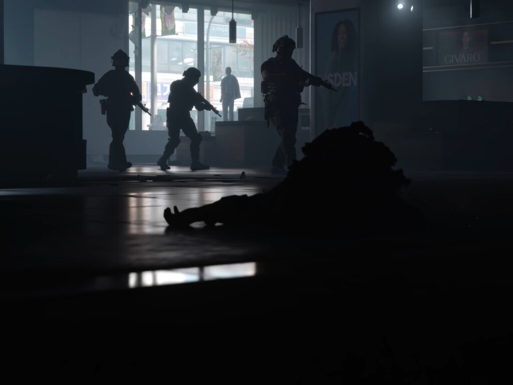 Three soldiers walk into a dark hall. Their appearance appear shadowy.